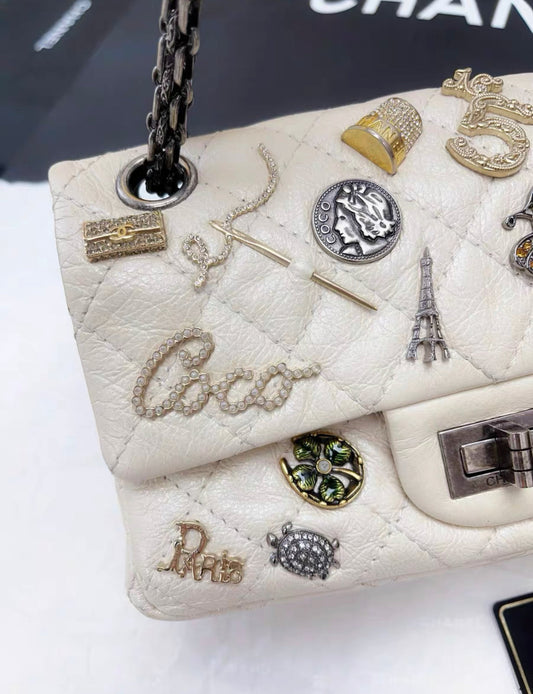 Chanel Pearl White Quilted Leather Limited Edition Lucky Charm Reissue 2 55 Classic Flap Bag Rovelle Bags