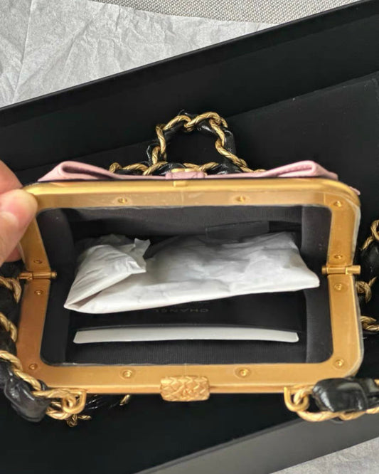 Chanel Mini Clutch With Bow Crossbody Bag Black Shiny Lambskin And Pink Patent Crumpled Lambskin Antique Gold Hardware Rovelle Bags