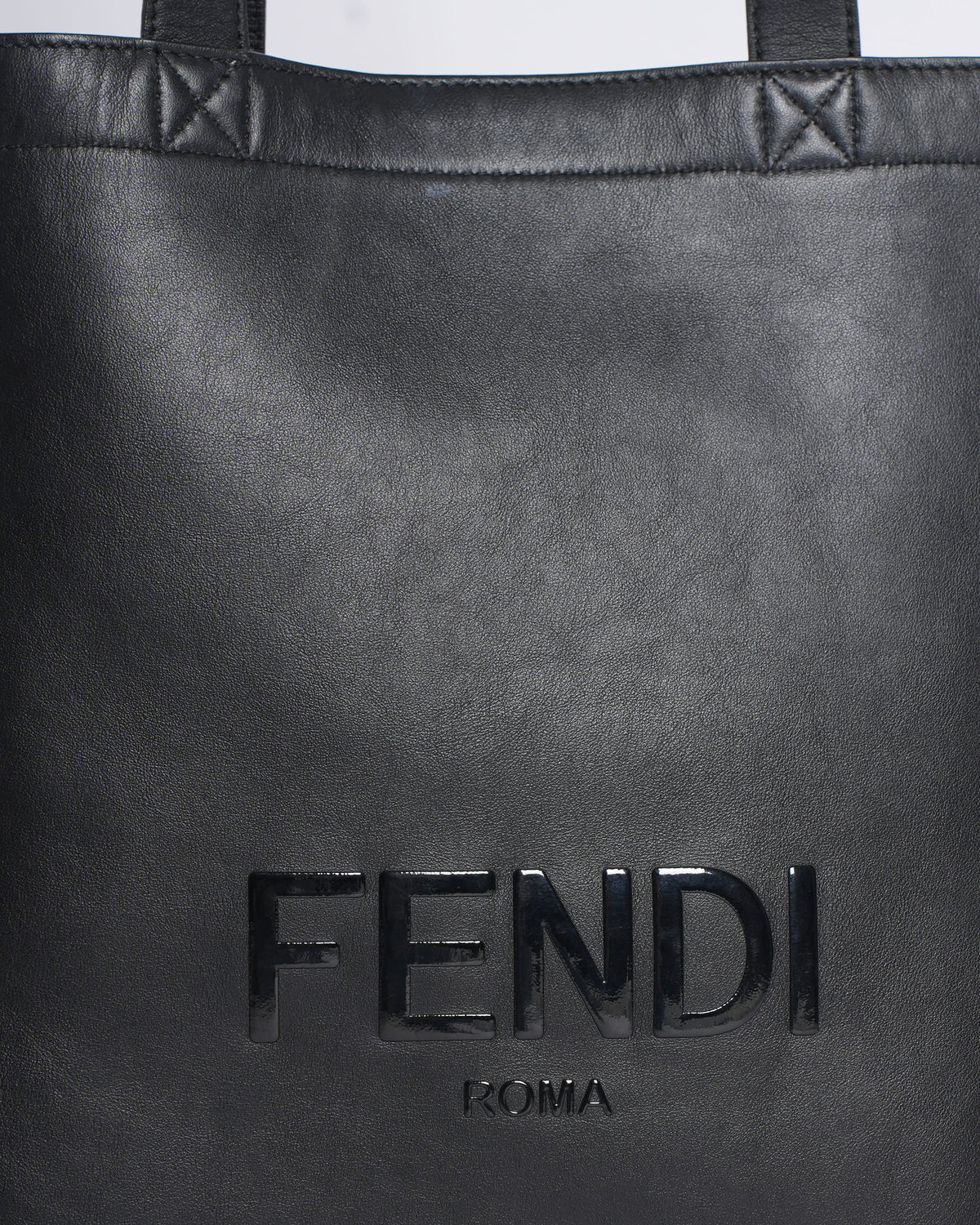 Fendi logo debossed shopper tote bag in black Rovelle Bags
