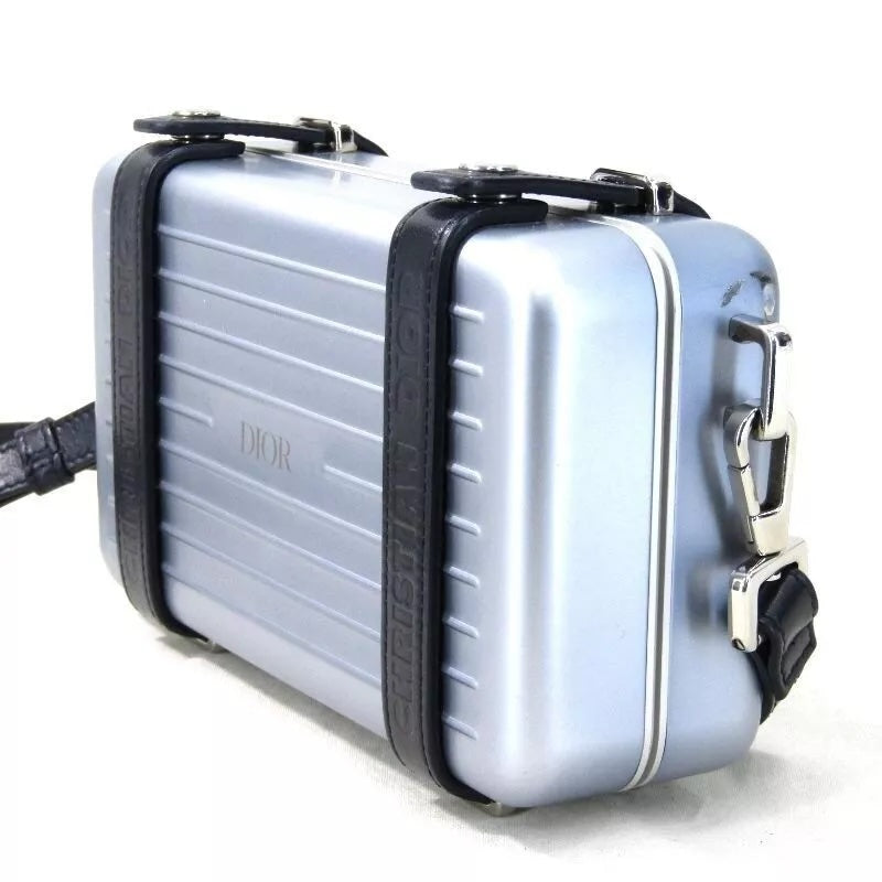 DIOR X RIMOWA ALUMINUM PERSONAL CLUTCH ON STRAP Rovelle Bags
