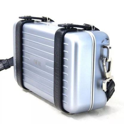 DIOR X RIMOWA ALUMINUM PERSONAL CLUTCH ON STRAP Rovelle Bags