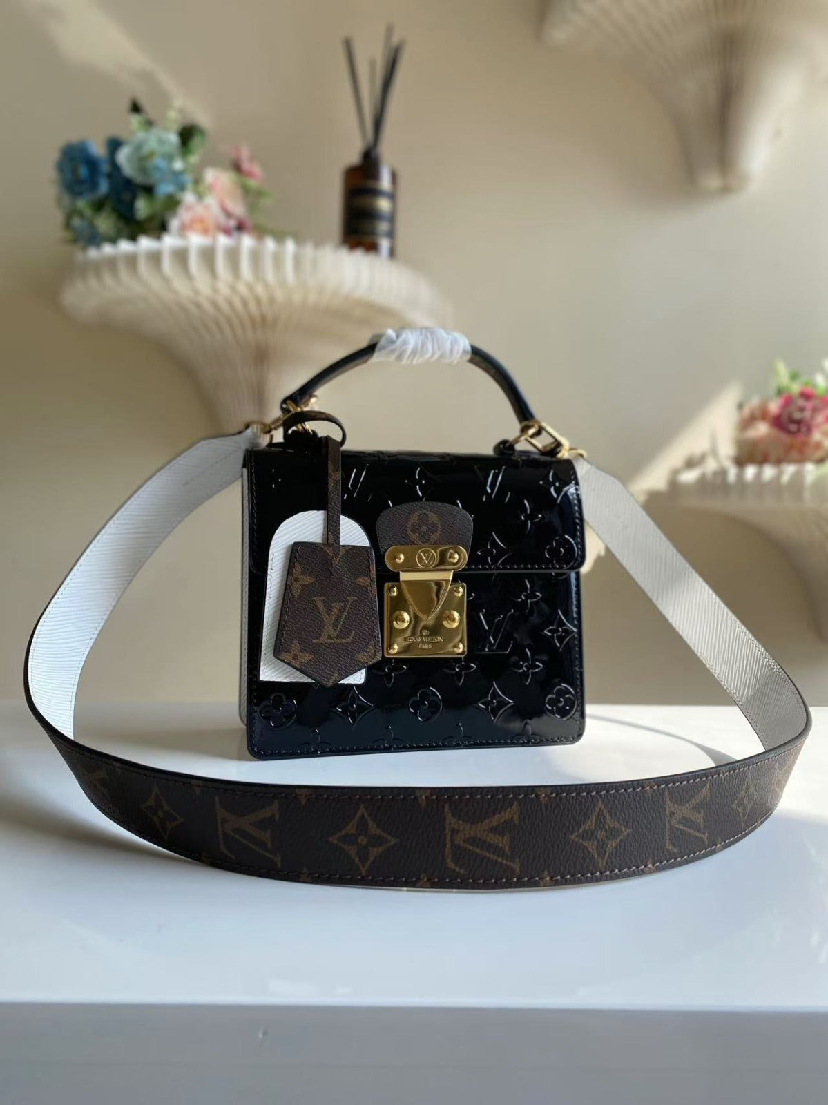 LOUIS VUITTON
Noir Monogram Vernis Leather Spring Street NM Bag