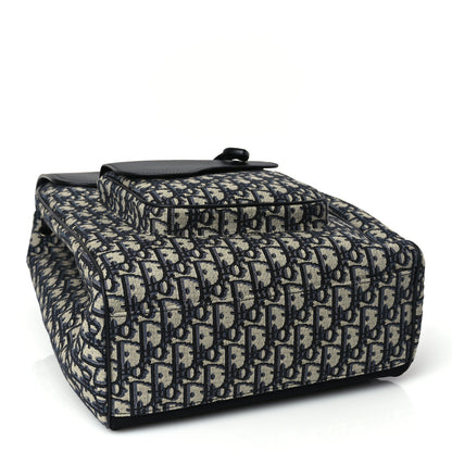 Christian Dior Oblique Jacquard Grained Calfskin Drawstring Saddle Backpack Beige Black Oblique Monogram Rovelle Bags