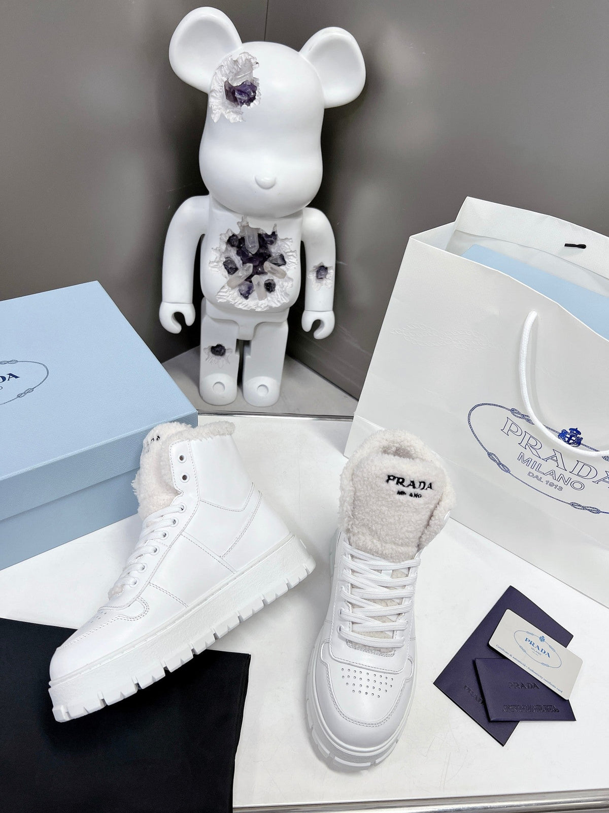 Prada Leather And Shearling High Top  Sneakers
