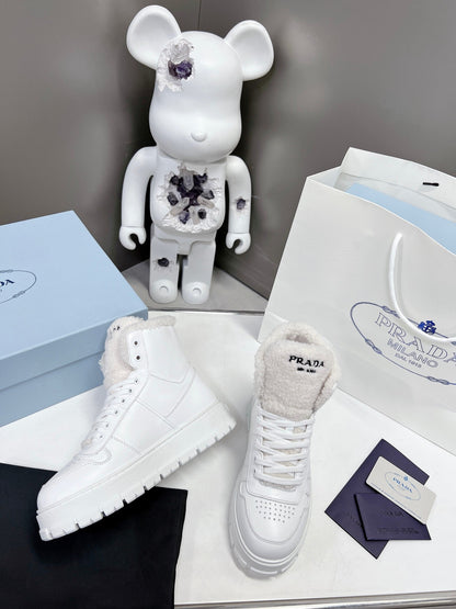 Prada Leather And Shearling High Top  Sneakers
