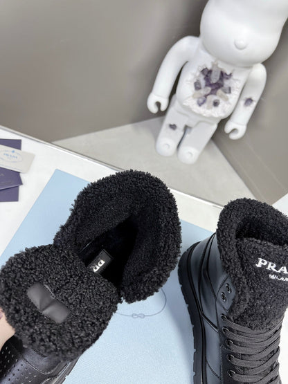 Prada Leather And Shearling High Top  Sneakers