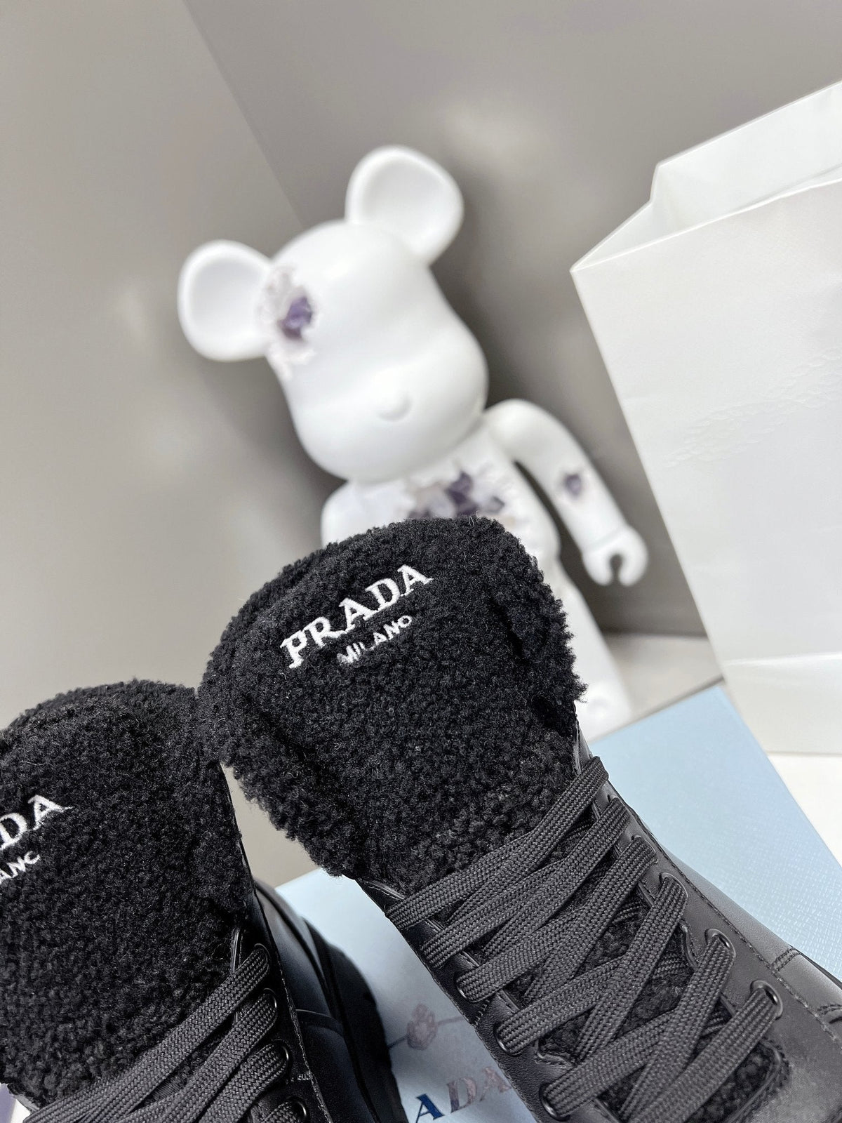 Prada Leather And Shearling High Top  Sneakers