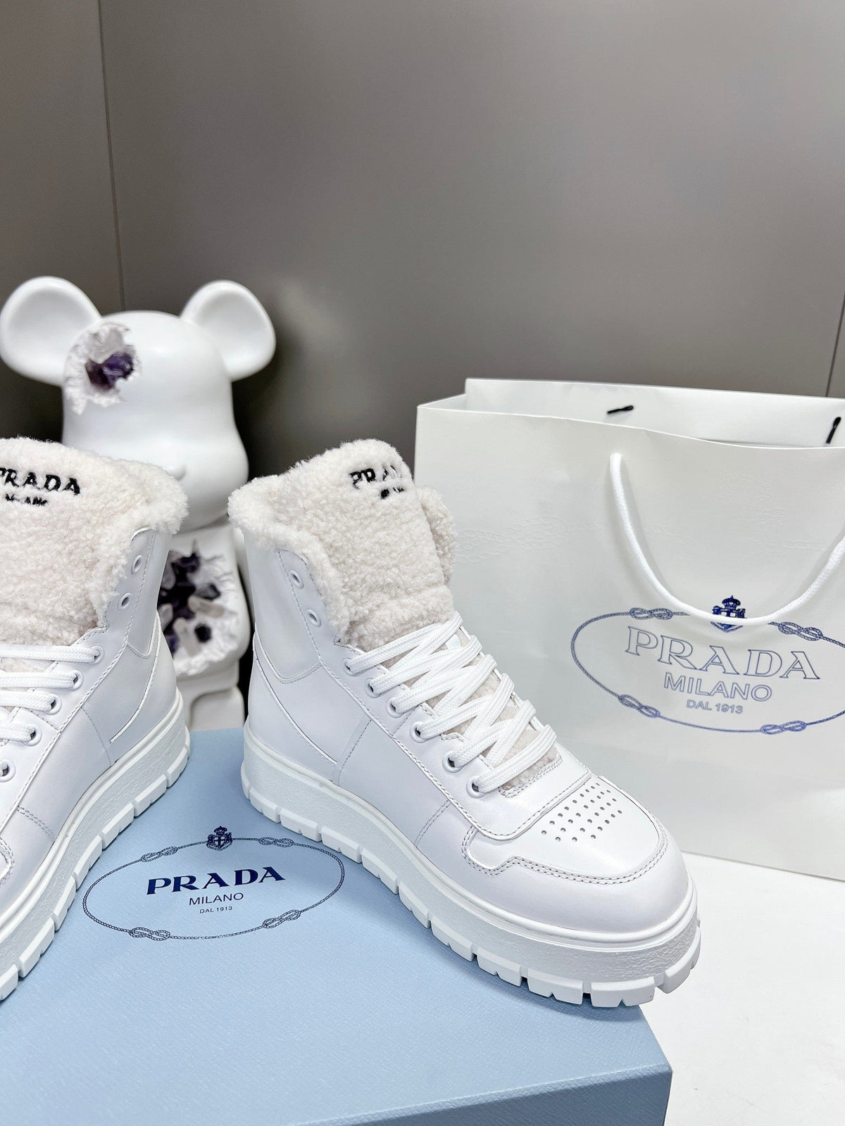 Prada Leather And Shearling High Top  Sneakers