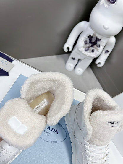 Prada Leather And Shearling High Top  Sneakers