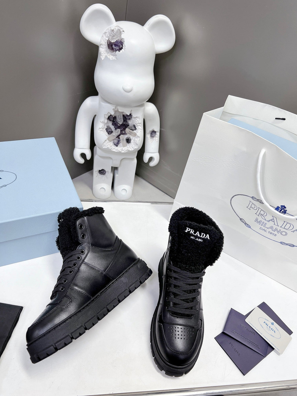 Prada Leather And Shearling High Top  Sneakers