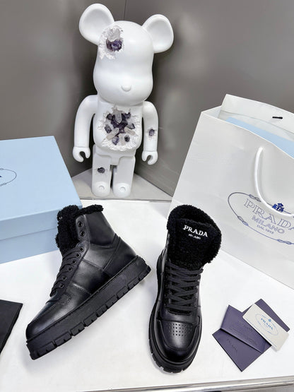 Prada Leather And Shearling High Top  Sneakers
