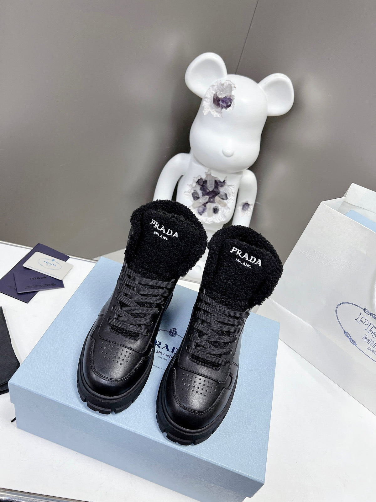 Prada Leather And Shearling High Top  Sneakers