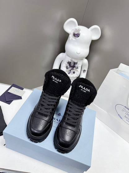 Prada Leather And Shearling High Top  Sneakers