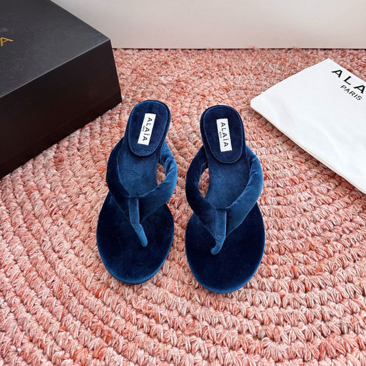 ALAIA 26S HEELED THONG SANDALS IN DARK BLUE VELVET