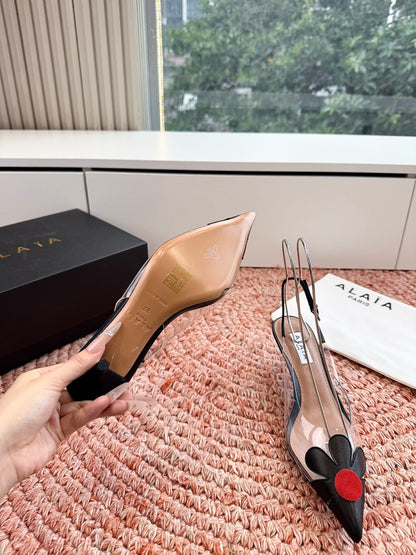 ALAIA 26S POINTED-TOE SLINGBACK HEELS IN BLACK LAMBSKIN AND TRANSPARENT PVC