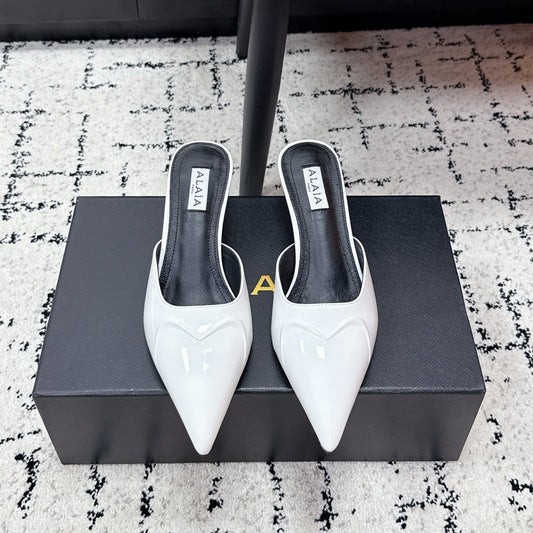 ALAIA 26S HEELED MULES 65 MM IN WHITE GLOSSY CALFSKIN