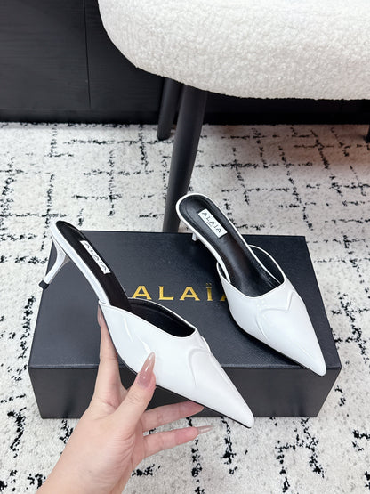 ALAIA 26S HEELED MULES 65 MM IN WHITE GLOSSY CALFSKIN
