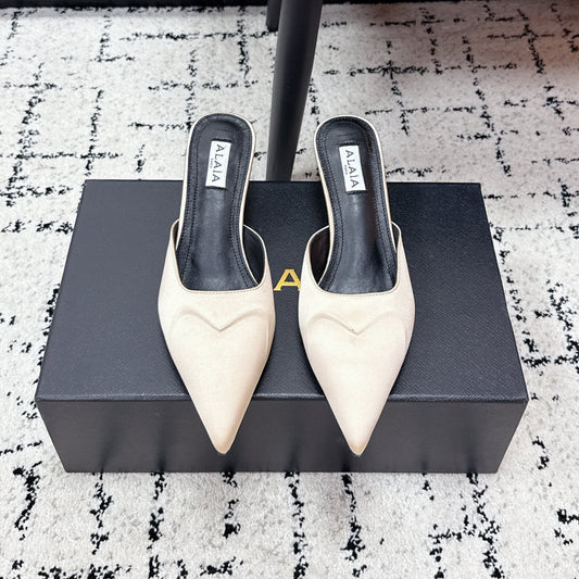 ALAIA 26S HEELED MULES 65 MM IN IVORY BEIGE SATIN
