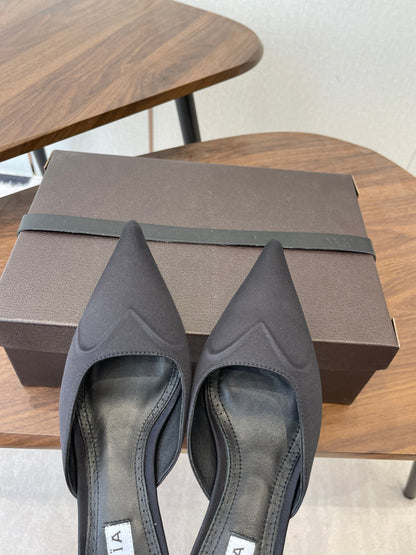ALAIA 26S HEELED MULES 50 MM IN BLACK FABRIC