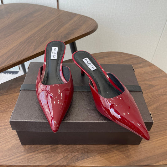 ALAIA 26S HEELED MULES 50 MM IN DARK RED GLOSSY CALFSKIN