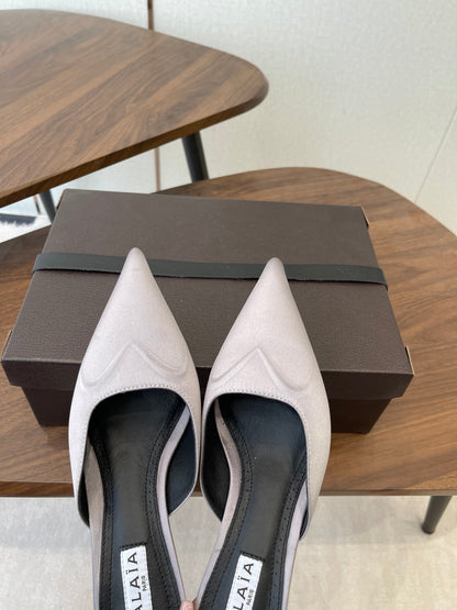 ALAIA 26S HEELED MULES 50 MM IN LAVENDER GREY FABRIC