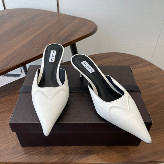 ALAIA 26S HEELED MULES 50 MM IN WHITE FABRIC