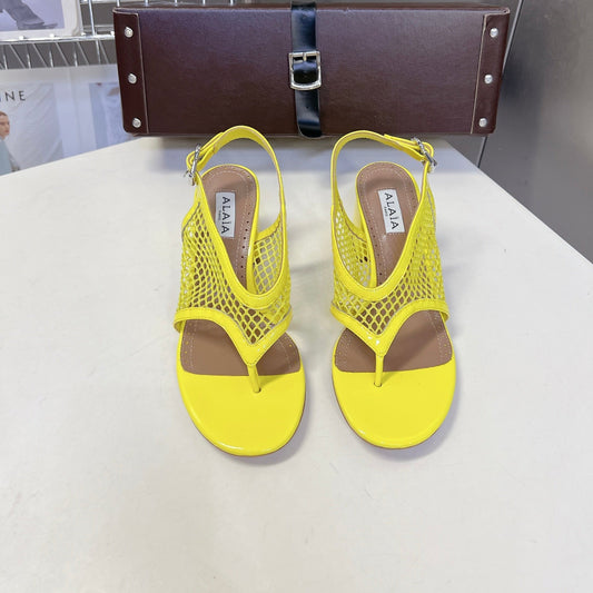 ALAIA 26S MESH THONG HEELS 55 MM IN YELLOW PATENT CALFSKIN