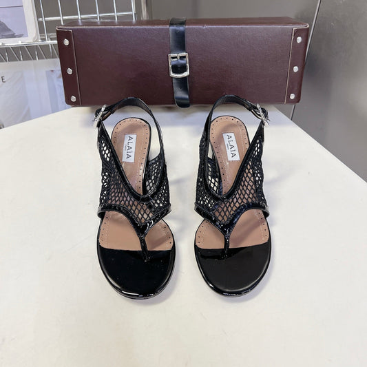 ALAIA 26S MESH THONG HEELS 55 MM IN BLACK PATENT CALFSKIN