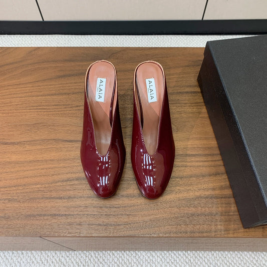 ALAIA 26S WEDGE MULES 70 MM IN DARK RED GLOSSY CALFSKIN