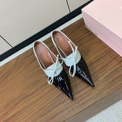 ALAIA 26S LACE-UP HEELED 105 MM IN BLACK AND WHITE GLOSSY CALFSKIN