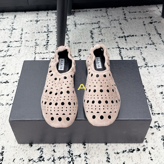 ALAIA 26S FLAT SLIP-ONS IN NUDE PINK SUEDE WITH OPENWORK PATTERN