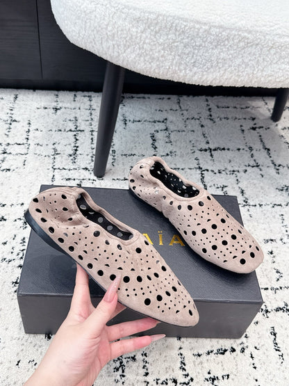 ALAIA 26S FLAT SLIP-ONS IN NUDE PINK SUEDE WITH OPENWORK PATTERN