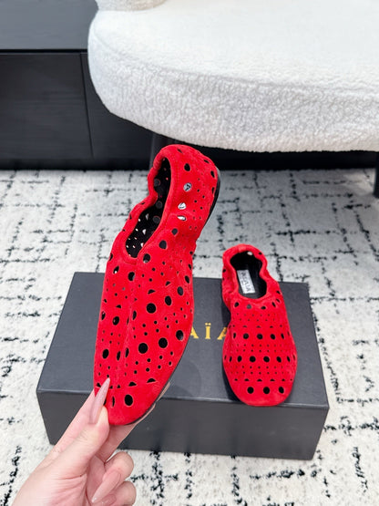 ALAIA 26S FLAT SLIP-ONS IN RED SUEDE WITH OPENWORK PATTERN