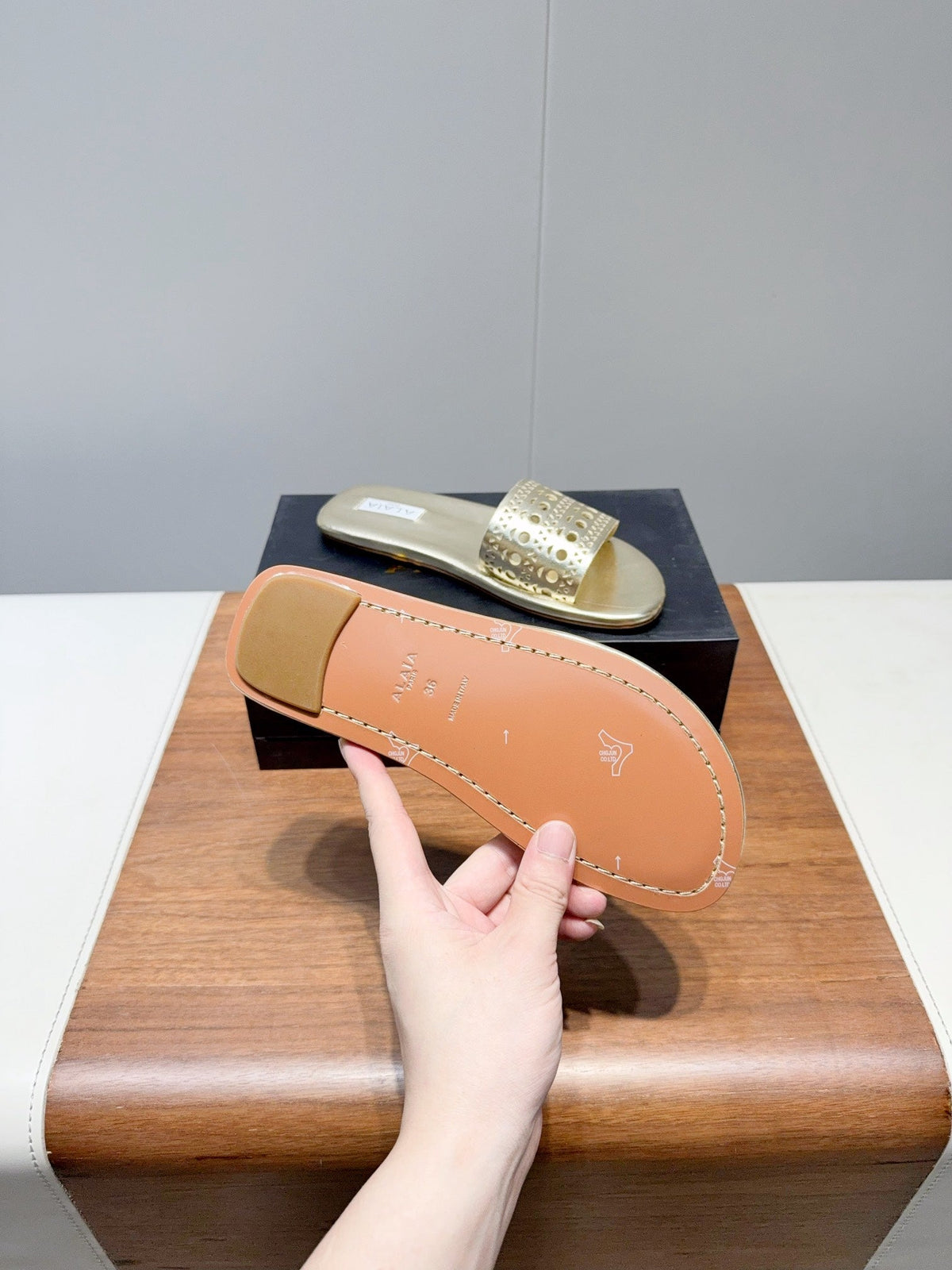 ALAIA FLAT SANDALS WITH PERFORATED STRAPS 25S IN GOLD LAMBSKIN