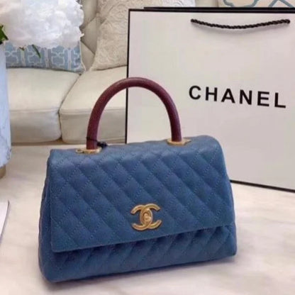 Chanel Grained Calfskin Maxi Flap Bag with Top Handle