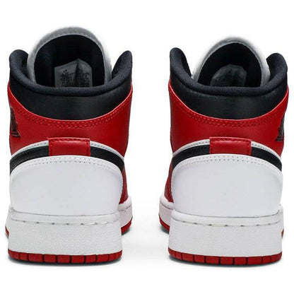 Nike Air Jordan 1 Mid GS 'Chicago white toe'.