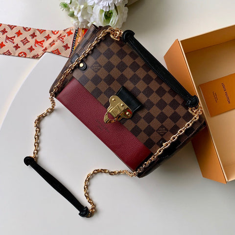 Metal latch handbag