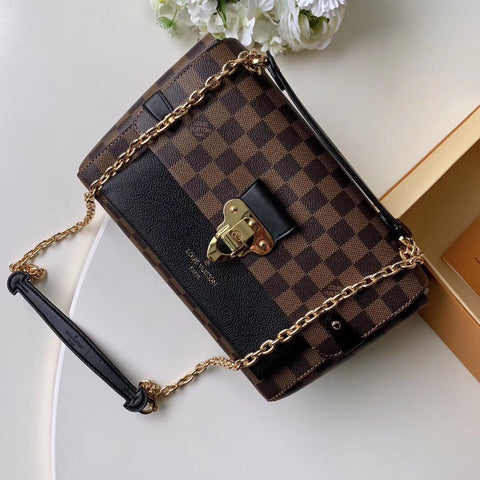 Metal latch handbag