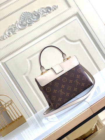 lock handbag white and brown
