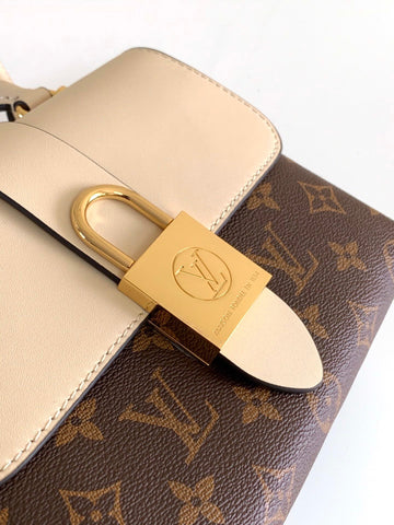 lock handbag white and brown