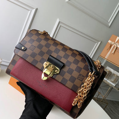 Metal latch handbag
